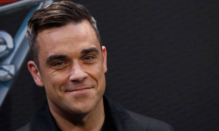 Robbie Williams: «Ποτέ δεν αντιλαµβάνοµαι γιατί αρέσει σε µερικούς ανθρώπους αυτό που κάνω»